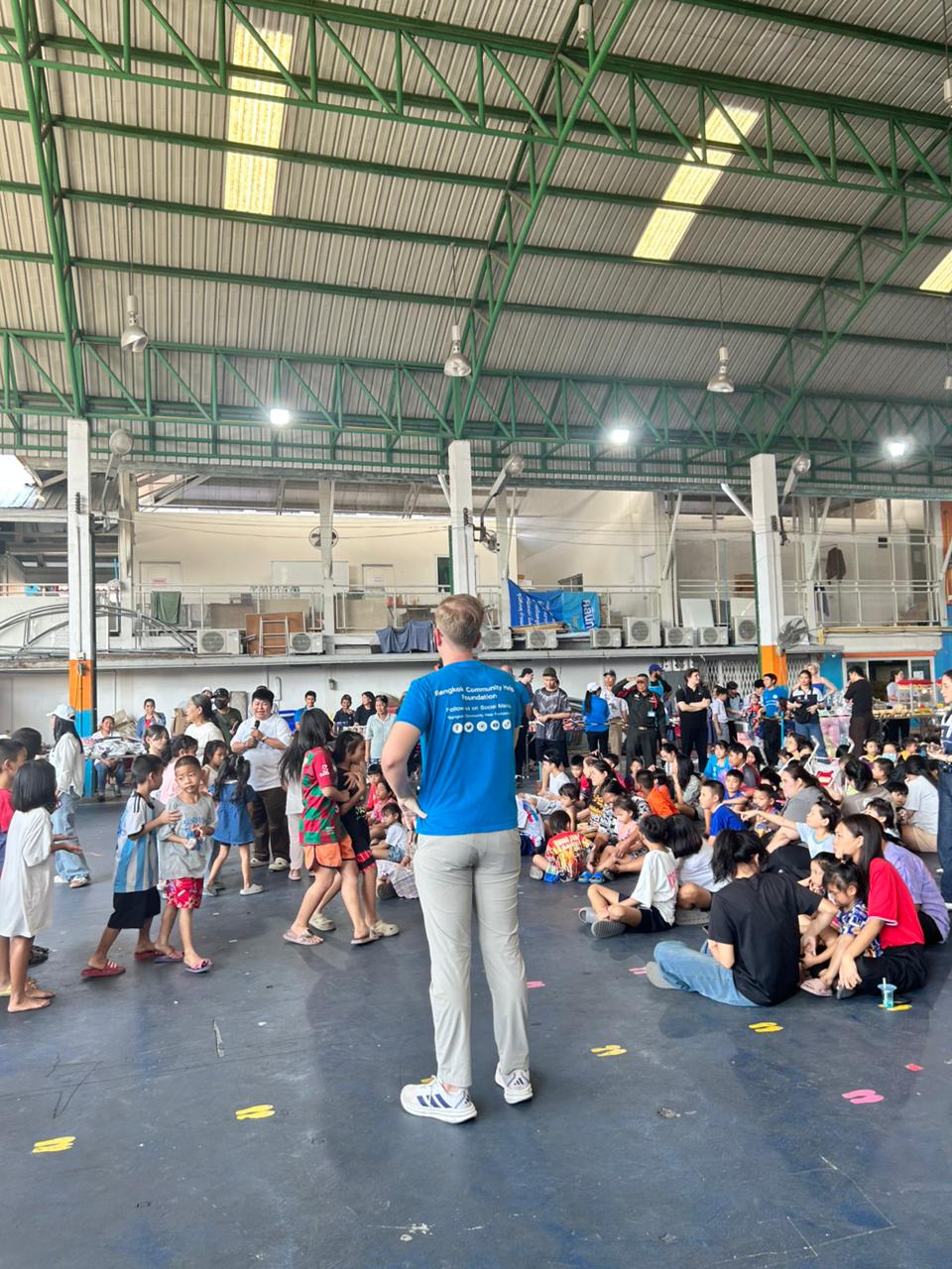 Mewayz team running a community giving day in Hat Yai, Thailand